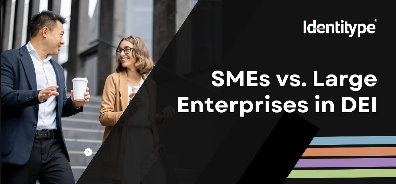 Two professionals, a man and a woman, are engaged in a friendly conversation while walking down the steps outside a modern office building, with text overlay stating 'SMEs vs. Large Enterprises in DEI' next to the Identitype® logo.